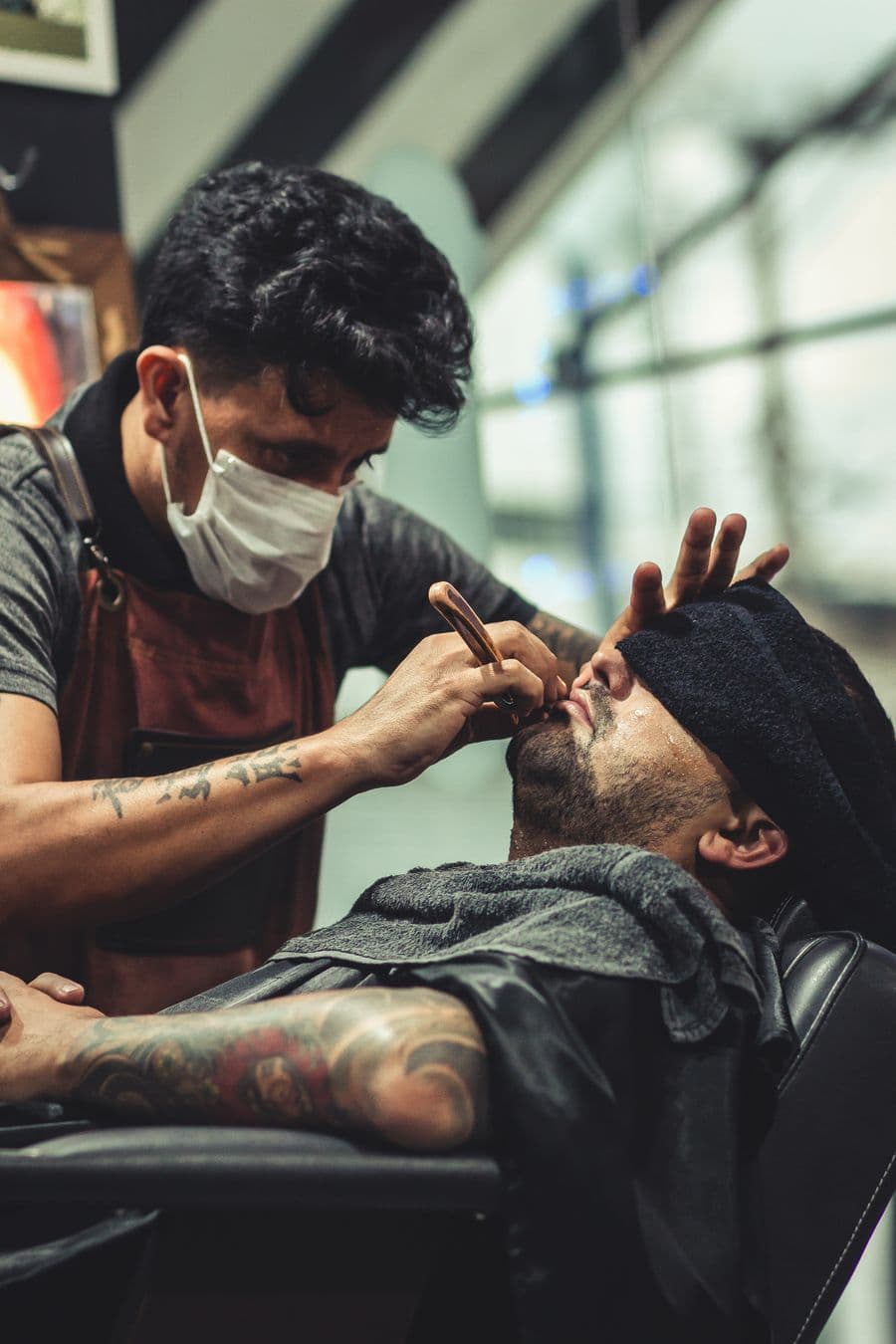 Straight-razor shave in a barbershop